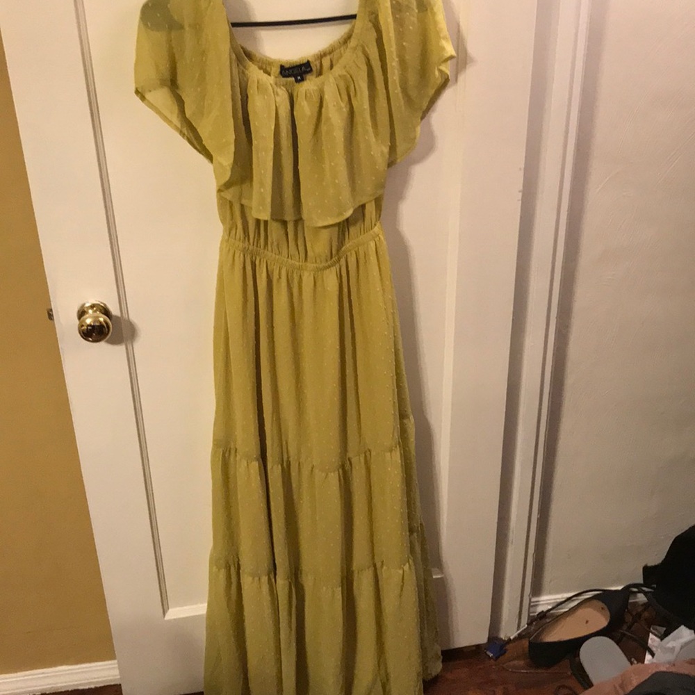 Off the shoulder, yellow dress with ruffle.